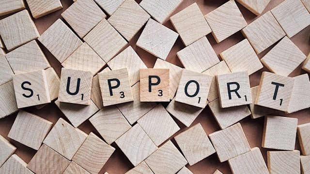 Wooden Block Spelling Out The Word 'Support'