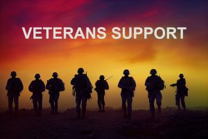 Image Description: Silhouette of Soldiers Against A Sunset. Veterans Support. Image Credit: https://pixabay.com/photos/veteran-military-soldier-sunset-7499156/