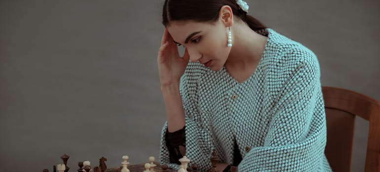 A woman playing chess. 