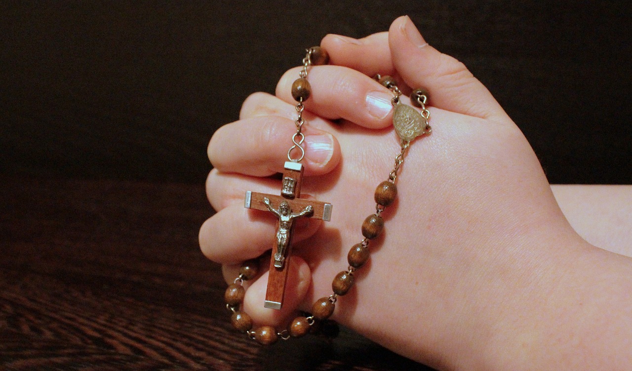 Hands holding Rosary