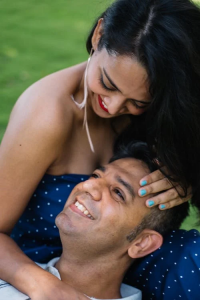 Woman Caressing a Mans Head, With Both Smiling At One Another.