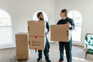Two men with moving boxes.