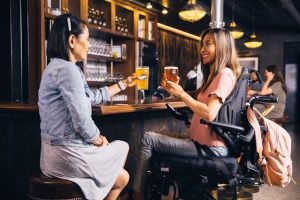 Two women holding drinks