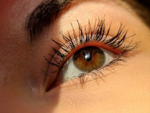 Closeup pf an eye with long lashes: Photo by Aleks on Unsplash