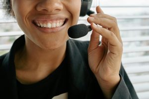 Image Credit & Description: https://www.pexels.com/photo/close-up-photo-of-a-smiling-woman-holding-microphone-8866772/