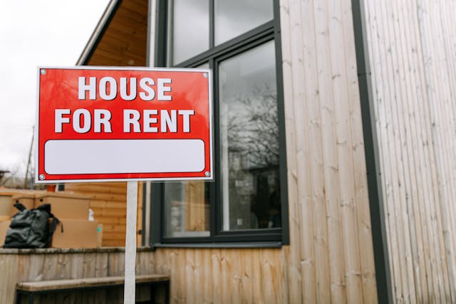 Image Description:  Sign in front of a house. Image Credit: https://www.pexels.com/photo/a-house-for-rent-placard-8963081/