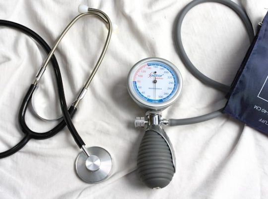Image Description: Medical equipment on a white sheet. Image Credit: https://unsplash.com/photos/a-stethoscope-laying-on-top-of-a-bed-next-to-a-medical-bag-f0h8EIdTXWo