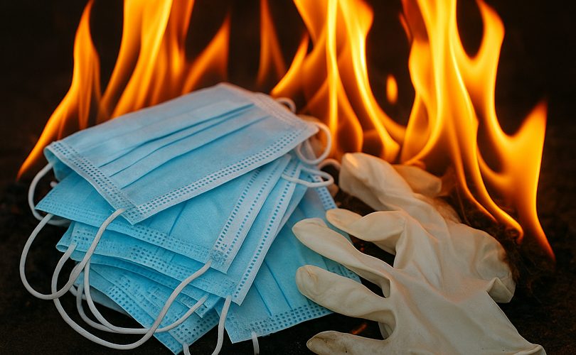 Image Description: A Pile Of PPE Up In Flames. Image Credit: AI-generated illustration created with assistance from ChatGPT (© DisabledEntrepreneur.UK, 2025).