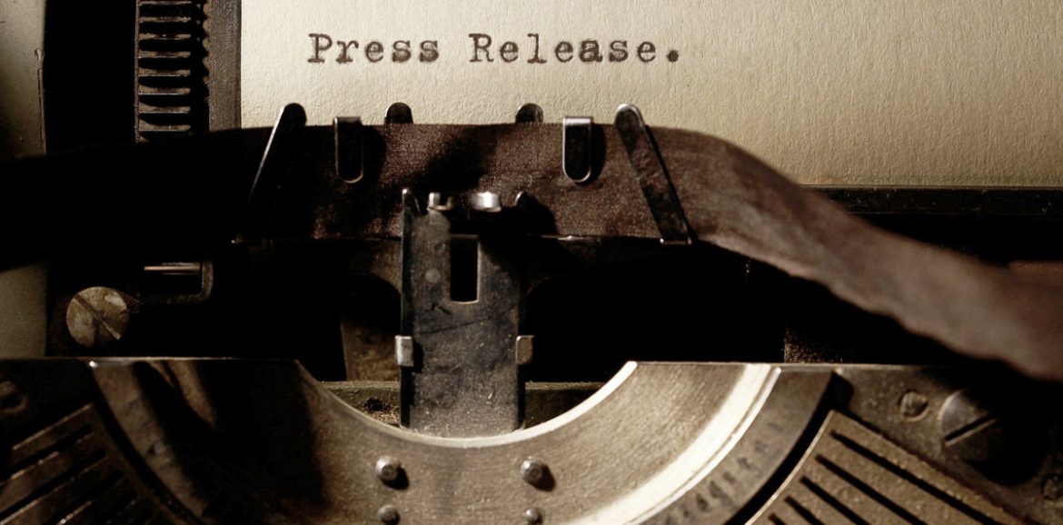 Image Description: Brown & Cream Coloured Image Depicting a Typewriter With Wording "Press Release". Typed On Paper. Image Credit: PhotoFunia.com Category: Vintage Typewriter.