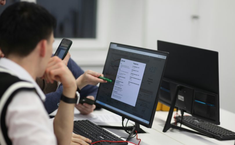 Image Description: A group of people sitting at a table with computers. Image Source:https://unsplash.com/photos/a-group-of-people-sitting-at-a-table-with-computers--JUlfa5fAIg?utm_source=unsplash&utm_medium=referral&utm_content=creditCopyText Image Credit: https://unsplash.com/@antoie?utm_source=unsplash&utm_medium=referral&utm_content=creditCopyText