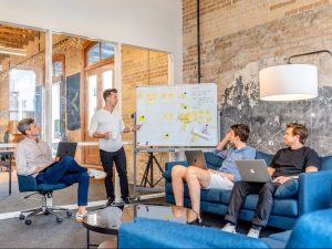 IMAGE DESCRIPTION: three men sitting while using laptops and watching man beside whiteboard. IMAGE CREDIT: https://unsplash.com/@austindistel IMAGE SOURCE: https://unsplash.com/photos/three-men-sitting-while-using-laptops-and-watching-man-beside-whiteboard-wD1LRb9OeEo?utm_source=unsplash&utm_medium=referral&utm_content=creditCopyText