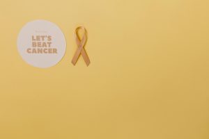 Image Description: Orange Let's Beat Cancer Ribbon. Image Credit: Tara Winstead. Image Source: https://www.pexels.com/photo/text-7723567/