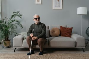 Image Description: A blind man wearing sunglasses, while holding his white cane. Image Credit: Tima Miroshnichenko Image Source: https://www.pexels.com/photo/a-blind-man-wearing-sunglasses-while-holding-his-white-cane-6609416/