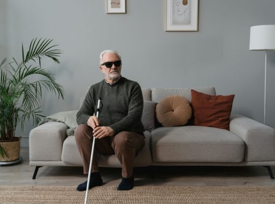 Image Description: A blind man wearing sunglasses, while holding his white cane. Image Credit: Tima Miroshnichenko Image Source: https://www.pexels.com/photo/a-blind-man-wearing-sunglasses-while-holding-his-white-cane-6609416/