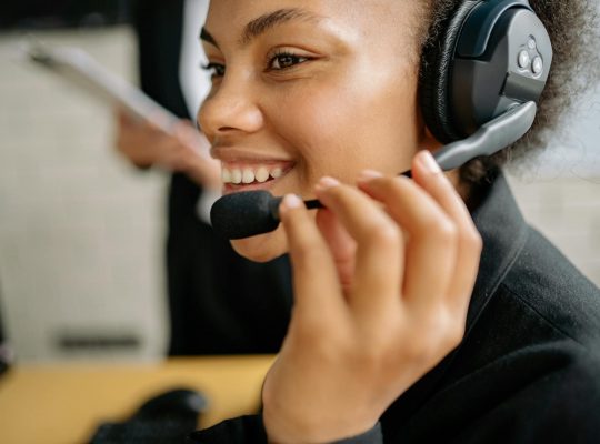 A smiling call center agent.