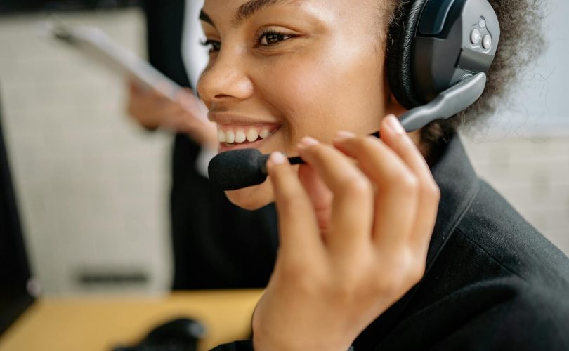 A smiling call center agent.