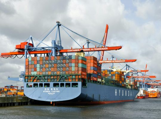 Image Description: Container Ship Docked At Hamburg Port Image Credit: Wolfgang Weiser Image Source: https://www.pexels.com/photo/container-ship-docked-at-hamburg-port-33113780/