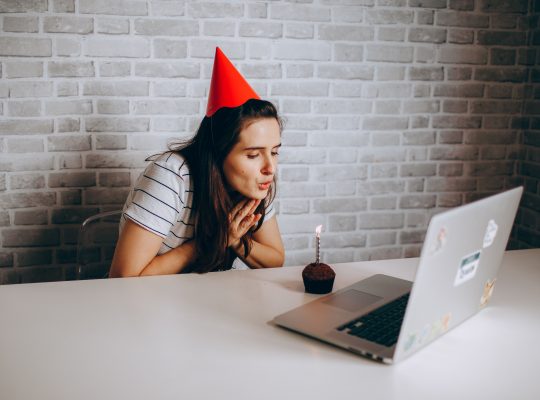 Image Description: A woman in a party hat blowing out a candle on her laptop Image Credit: https://www.pexels.com/@helenalopes/ Image Sources: https://www.pexels.com/photo/a-woman-in-a-party-hat-blowing-out-a-candle-on-her-laptop-27176746/