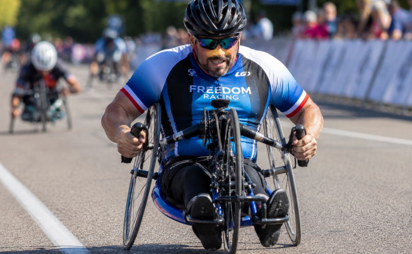 Disabled Person On An Adaptive Bike: Image Credit: The UK Website Designers Group. Copyright 2026