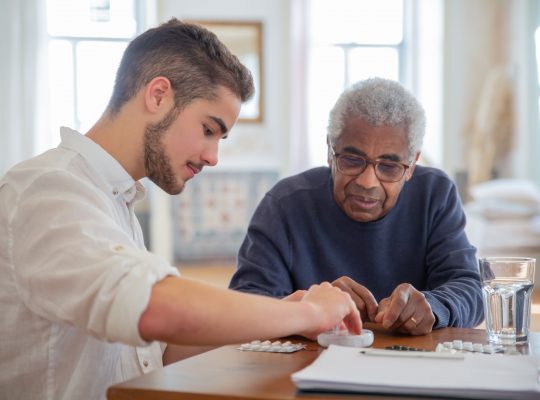 Image Description: A man in a blue sweater sitting beside a man in white long sleeves Image Credit: Kampus Production Image Source: https://www.pexels.com/photo/a-man-in-blue-sweater-sitting-beside-man-in-white-long-sleeves-7551646/