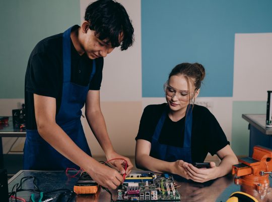 Image Description: Man and Woman Testing a Motherboard Image Credit: Mikhail Nilov - https://www.pexels.com/@mikhail-nilov/ Image Source: https://www.pexels.com/photo/man-and-woman-testing-a-motherboard-9242807/