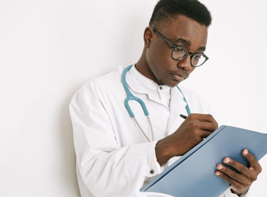 Image Description: A doctor writing on a folder Image Credit: https://www.pexels.com/@ivan-s/ Image Source: https://www.pexels.com/photo/a-doctor-writing-on-a-folder-4989132/
